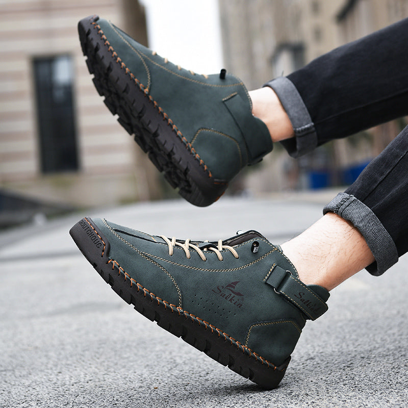 Dalton brown vegan leather boots with contrast stitching, adjustable strap, and deep-grip rubber sole