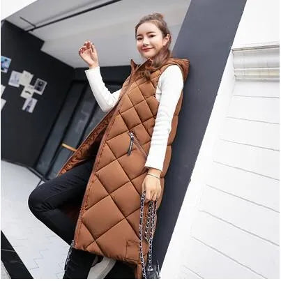 Women's long quilted hooded vest in winter tones, diamond quilt pattern, sleek layering silhouette