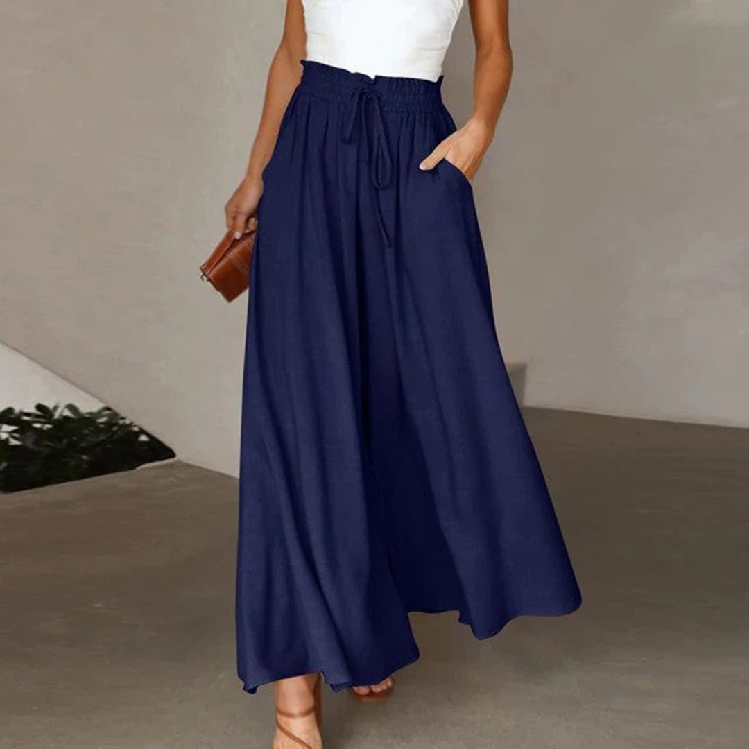 Women's terracotta high waist wide leg pants with smocked drawstring waistband and flowing silhouette