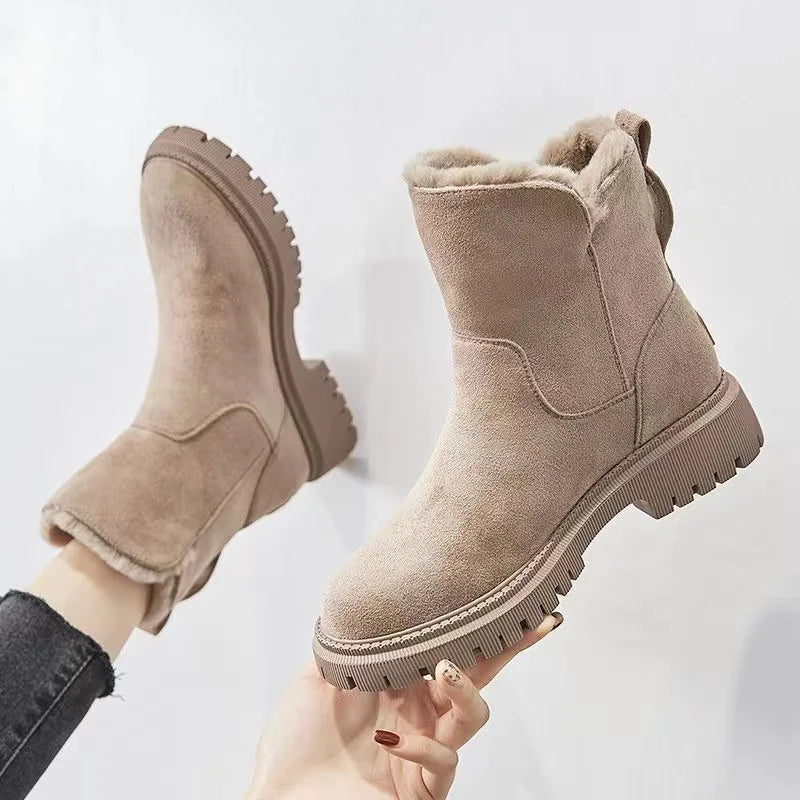 Beige faux fur-lined ankle boots with suede-inspired exterior and plush interior for women