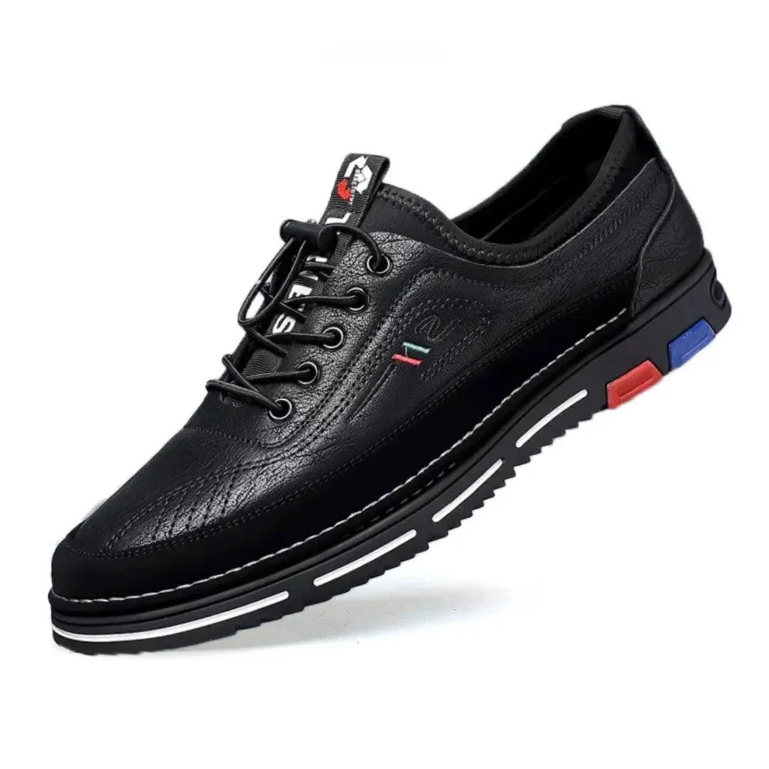 Derrick low-top faux leather sneakers with color-accented sole and lace-up front for urban style