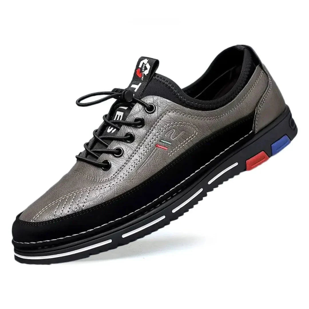 Derrick low-top faux leather sneakers with color-accented sole and cushioned lace-up design