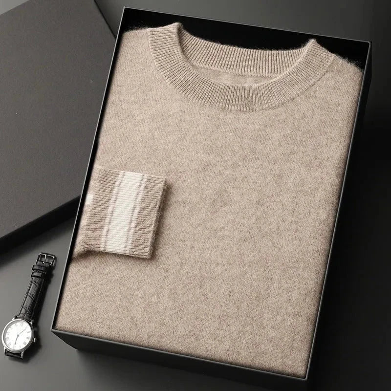 Ivory crewneck cashmere pullover with ribbed trim and subtle contrast stripe accent on cuffs