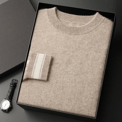 Ivory crewneck cashmere pullover with ribbed trim and subtle contrast stripe accent on cuffs