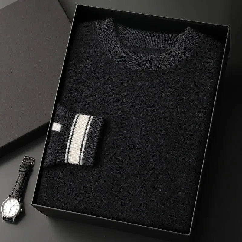 Ivory crewneck cashmere pullover with ribbed trim and subtle contrast stripe accent on cuffs