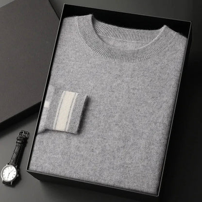Ivory crewneck cashmere pullover with ribbed trim and subtle contrast stripe accent on cuffs