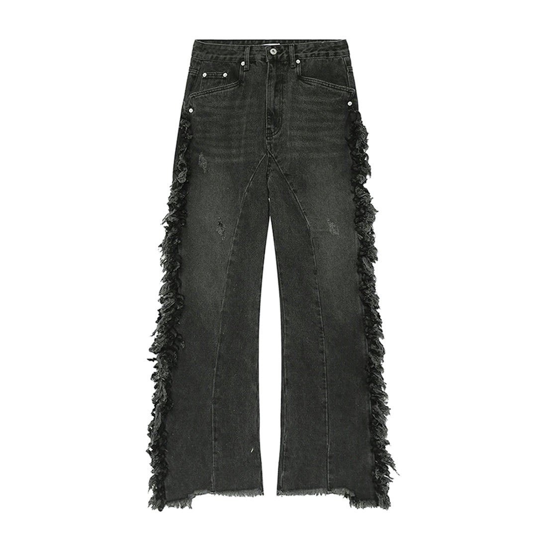 Distressed baggy flared jeans in blue denim with boho tassel hem detailing for relaxed weekend style