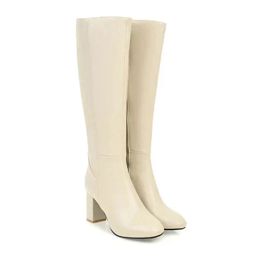 Women's black knee-high stiletto heeled boots with sleek tall shaft for a refined, leg-flattering silhouette