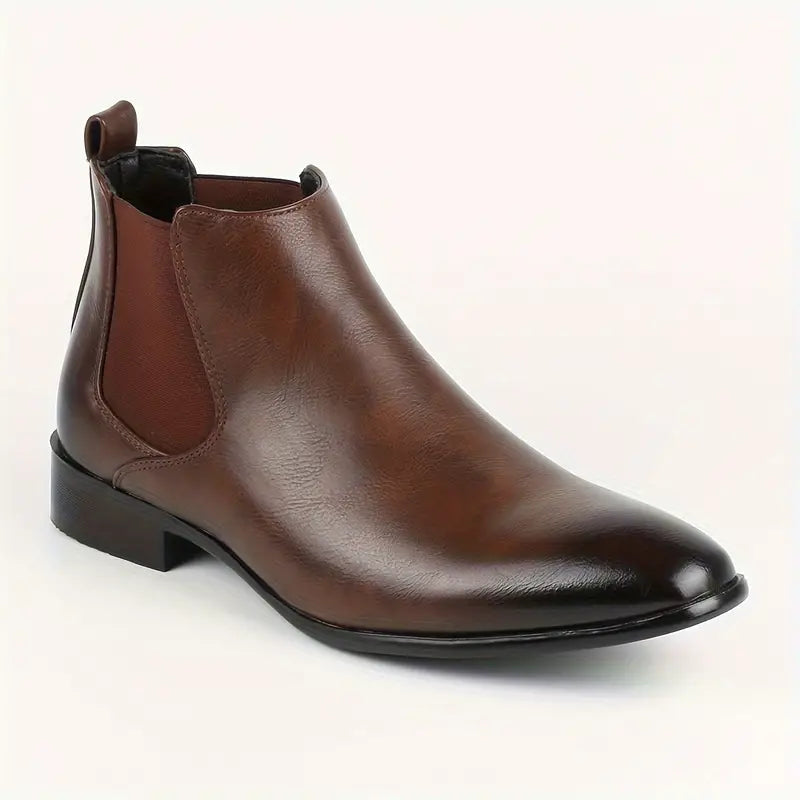 Black pointed-toe Chelsea boots with elastic side panels and sleek minimalist finish
