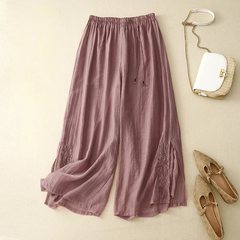 Elara white wide-leg linen pants with delicate floral embroidery detail