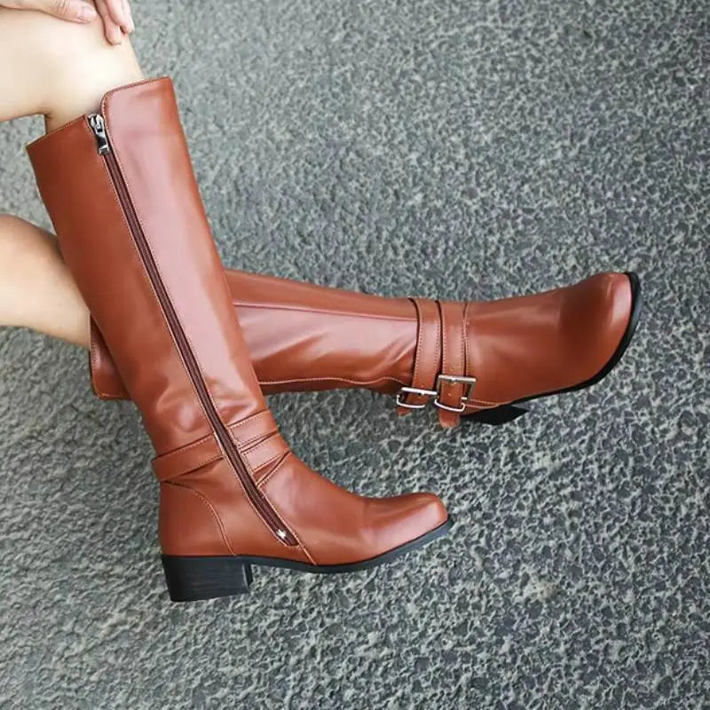 Women's black knee-high leather boots with plush lining, sleek silhouette, and elegant heel