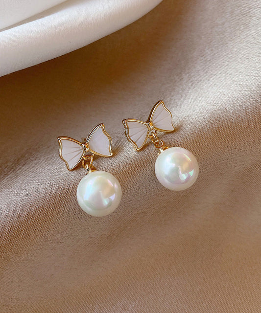 Boucles d'oreilles pendantes élégantes en alliage de cuivre blanc avec nœud en perles de coquillage - Wavlynn