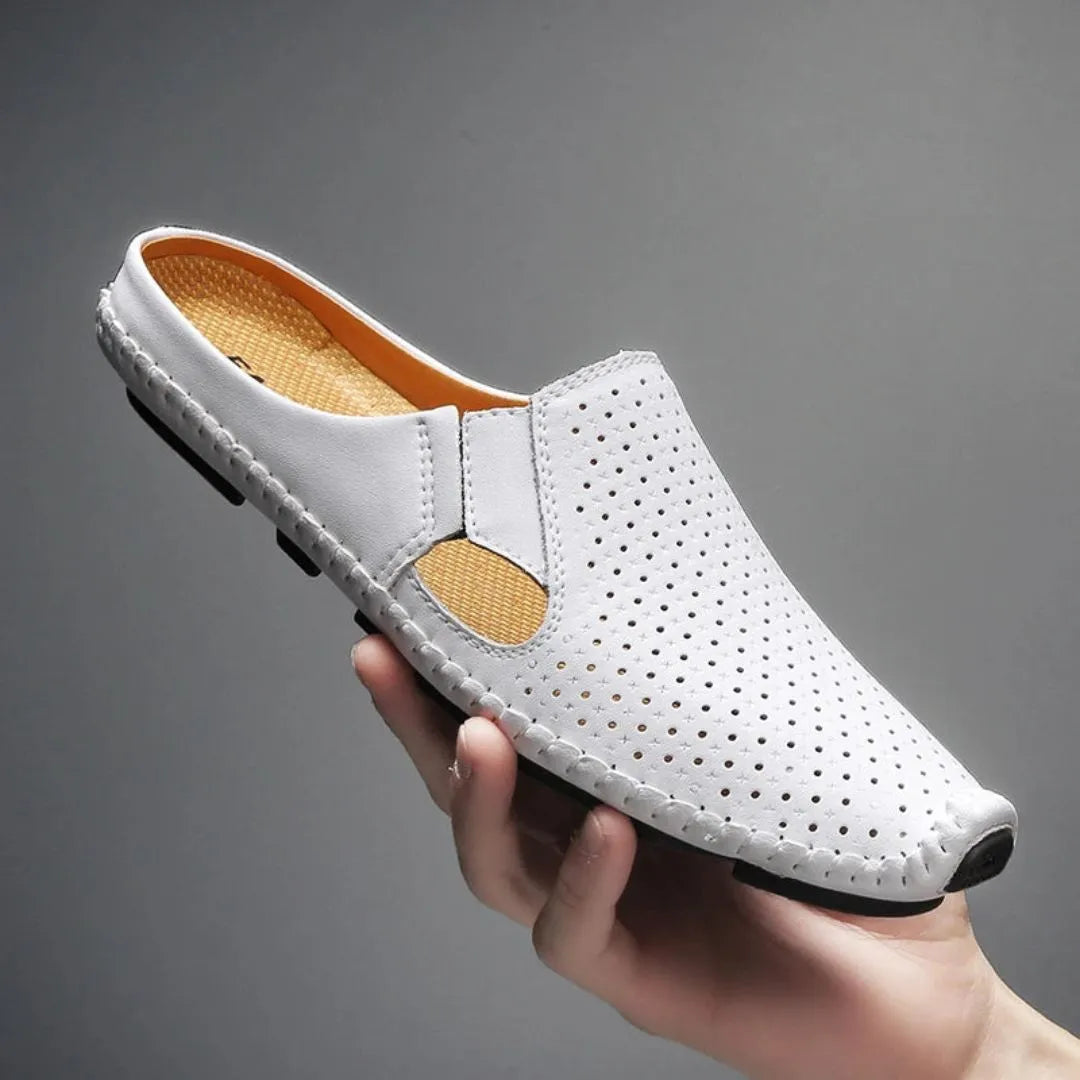 Wavlynn Eliano perforated faux leather mules with cut-out panels and cushioned insole for ventilated comfort