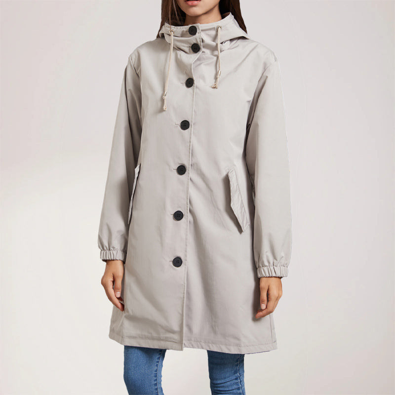 Beige mid-length trench coat with classic lapels and belted waist, polished everyday style