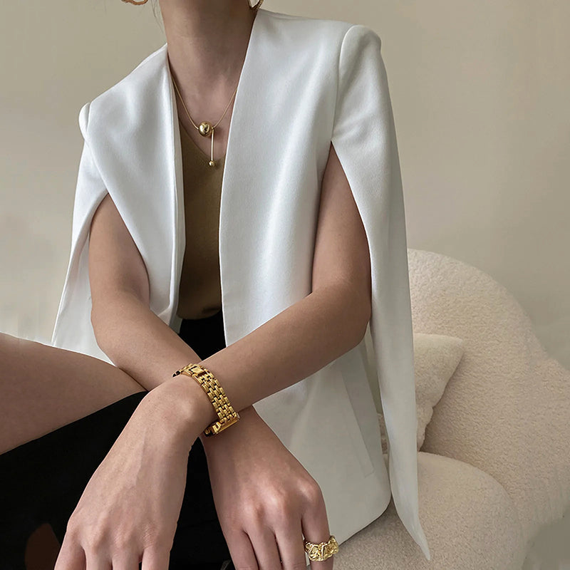 Ivory sleeveless cape-style cover-up jacket with open-front drape, lightweight elegant evening layer