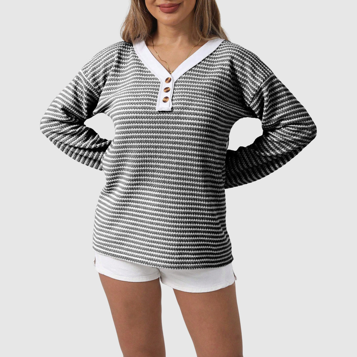 Cozy V-neck color-block knit sweater with button accents in autumn-ready premium polyester blend