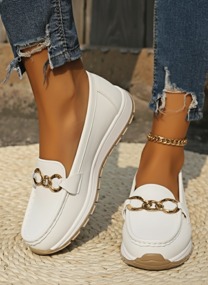 Beige vegan leather flat loafers with silver buckle detail, smooth texture, everyday polished style
