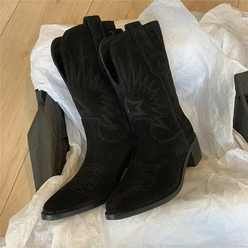 Women's warm brown embroidered Western boots with bold stitching detail and stylish pointed toe silhouette