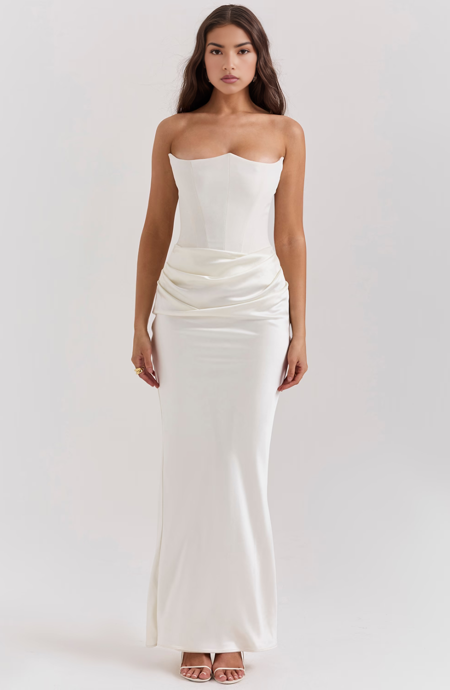 Women's ivory strapless lace evening dress with structured bodice and flowing hourglass silhouette