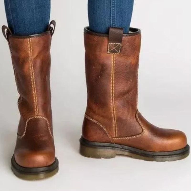 Chic women's rich brown vegan leather winter boots with cozy faux shearling lining and timeless silhouette