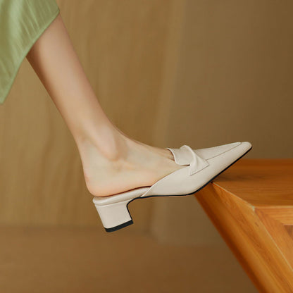 Women's leather mules with elegant bow-trim detail, cushioned insole, neutral tone slip-on style