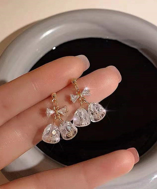 Boucles d'oreilles pendantes en zircon doré et cuivré, style tendance, avec nœud et clochette. - Wavlynn
