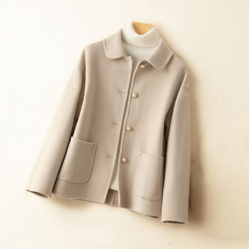 Ivory pure cashmere knit jacket with spread collar, button-front closure, and dual patch pockets