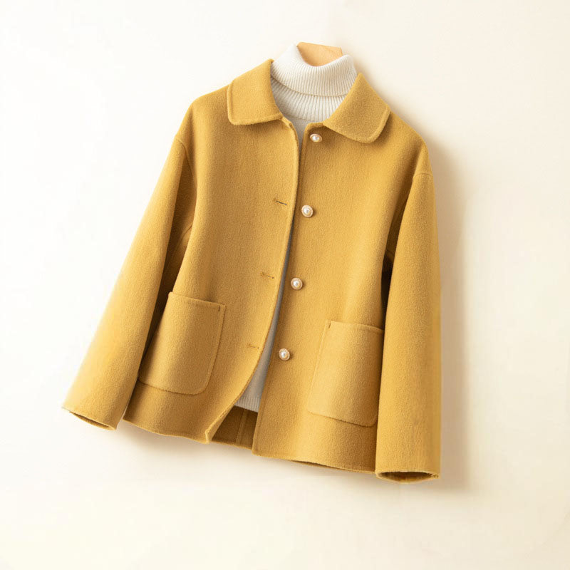 Ivory pure cashmere knit jacket with spread collar, button-front closure, and dual patch pockets