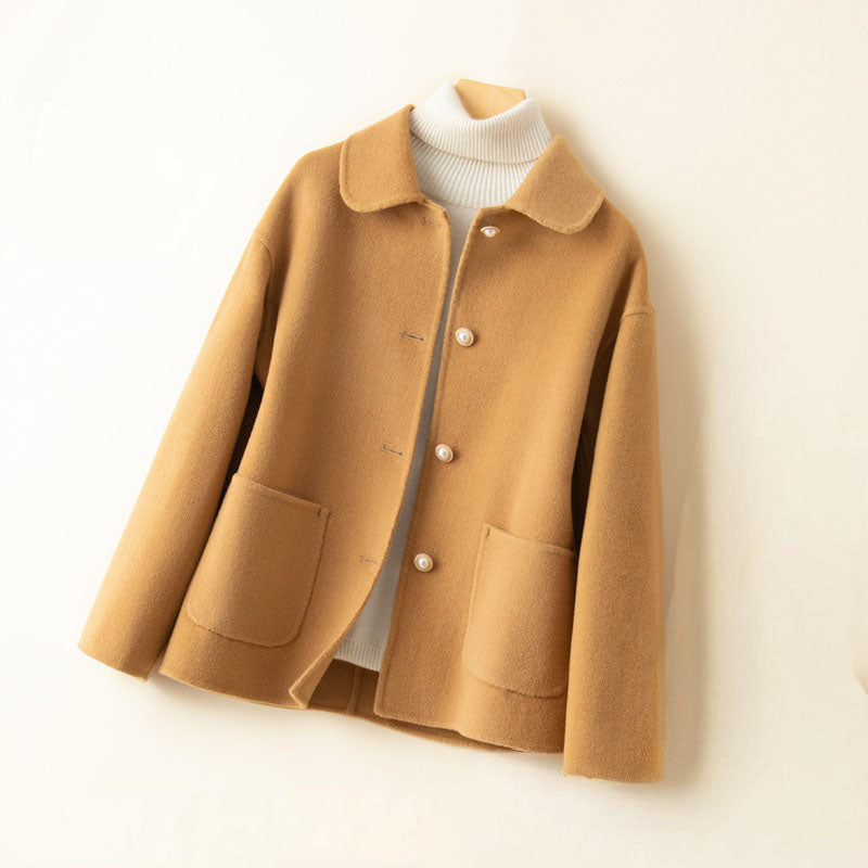 Ivory pure cashmere knit jacket with spread collar, button-front closure, and dual patch pockets