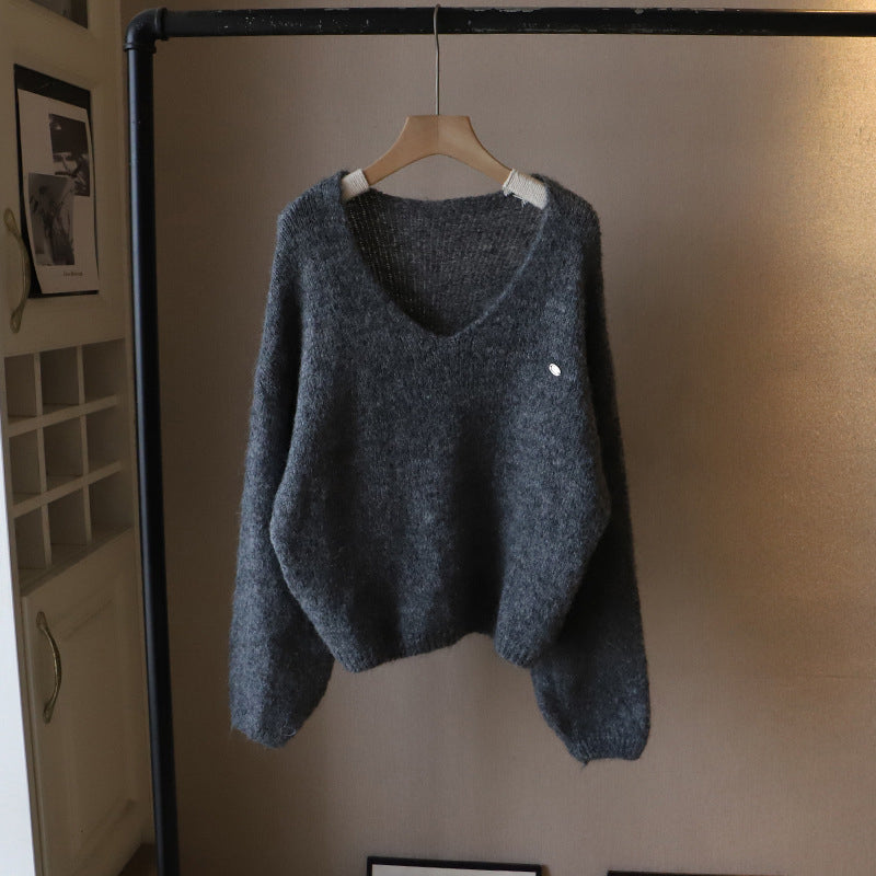 Ivory oversized V-neck sweater with ultra-soft drape and luxurious cloud-like knit texture