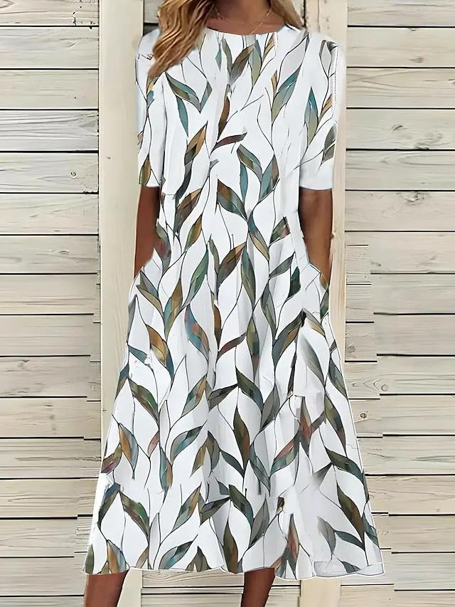 Women's floral A-line midi dress in botanical print, relaxed silhouette for day-to-night styling