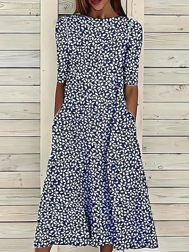 Women's floral A-line midi dress with botanical print, relaxed silhouette for day-to-night wear