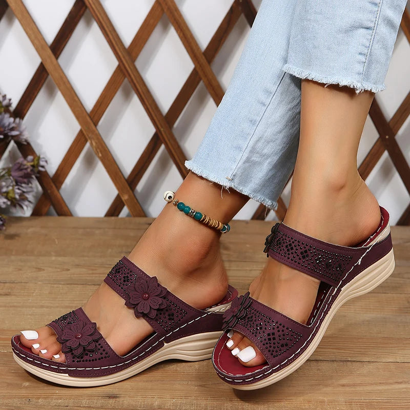 Women's wedge sandals with floral appliqué straps, cushioned footbed, stylish warm-weather heels
