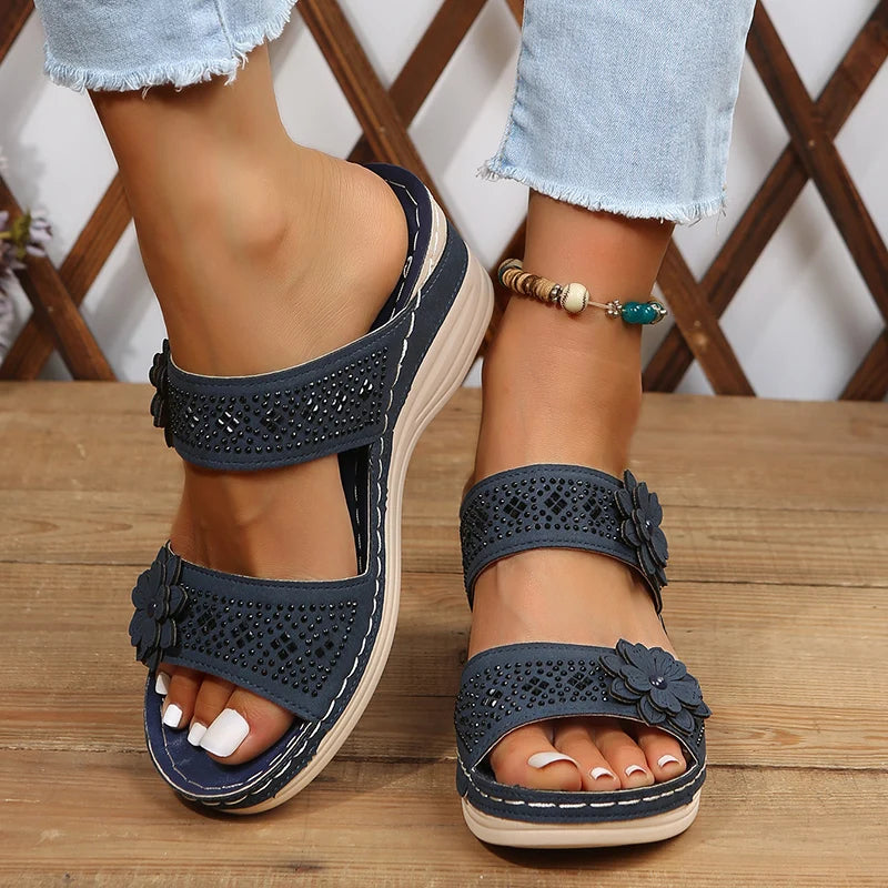 Women's wedge sandals with floral appliqué straps, cushioned footbed, stylish warm-weather heels