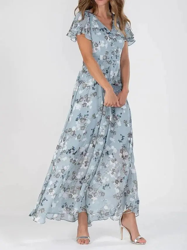 Women's floral maxi dress in vibrant multicolor print, flowy silhouette with tummy-friendly flattering cut