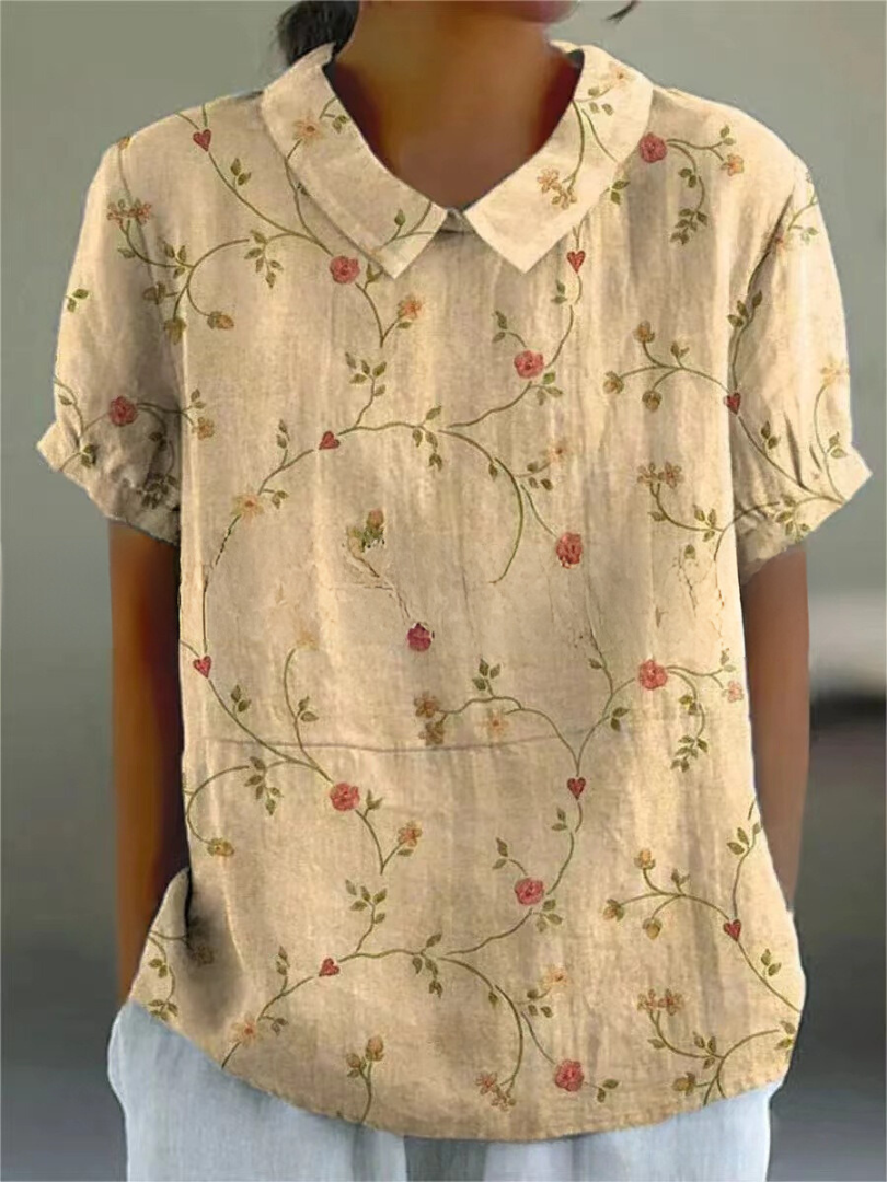 Women's relaxed floral print shirt with feminine blooms, light fabric, and effortless casual style