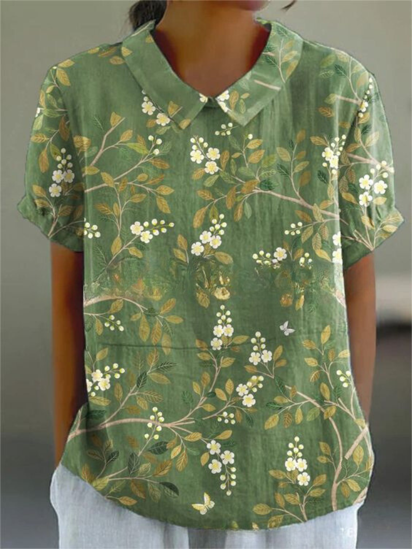 Women's relaxed floral print shirt with feminine bloom pattern and lightweight casual silhouette