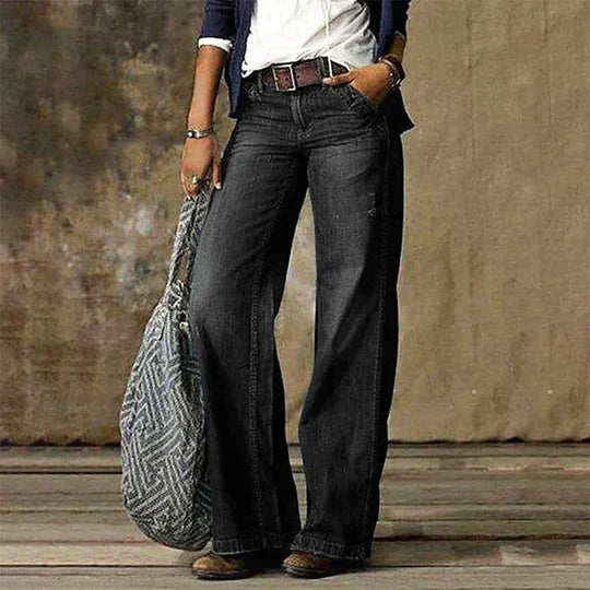 Women's high waist wide leg flare jeans in faded light-wash denim with retro vintage silhouette
