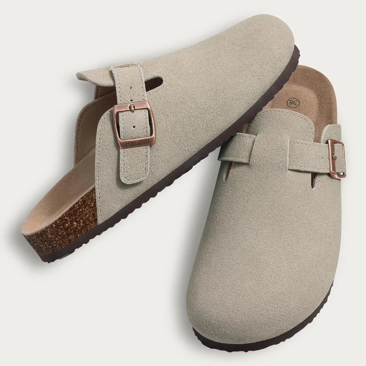 Women's brown suede fur-lined clogs with adjustable buckle strap, cozy winter mule style