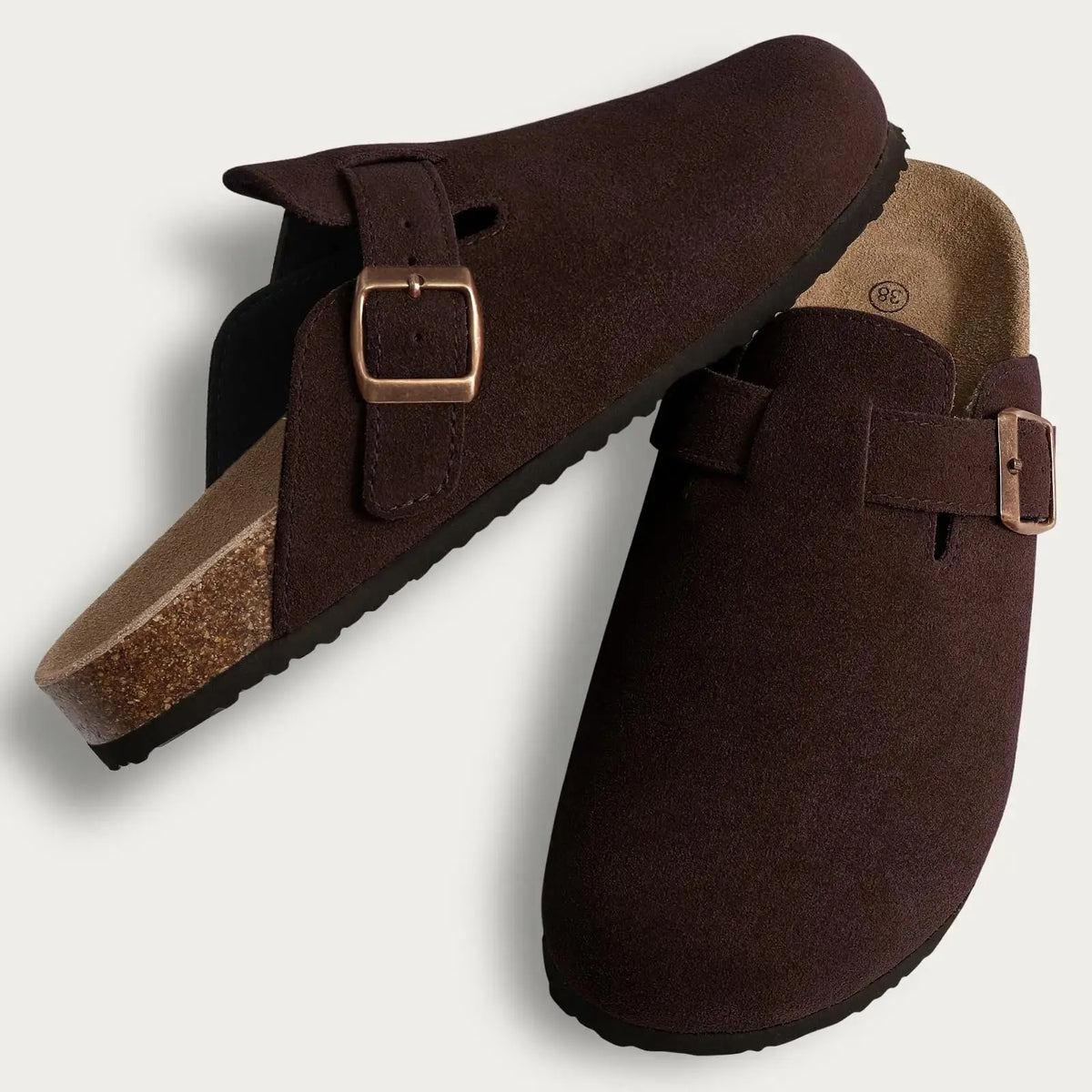 Women's brown suede fur-lined clogs with adjustable buckle strap, cozy winter mules