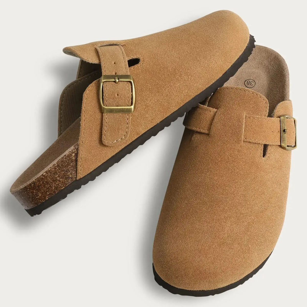 Women's fur-lined suede clogs in neutral tan with adjustable buckle strap for cozy winter comfort
