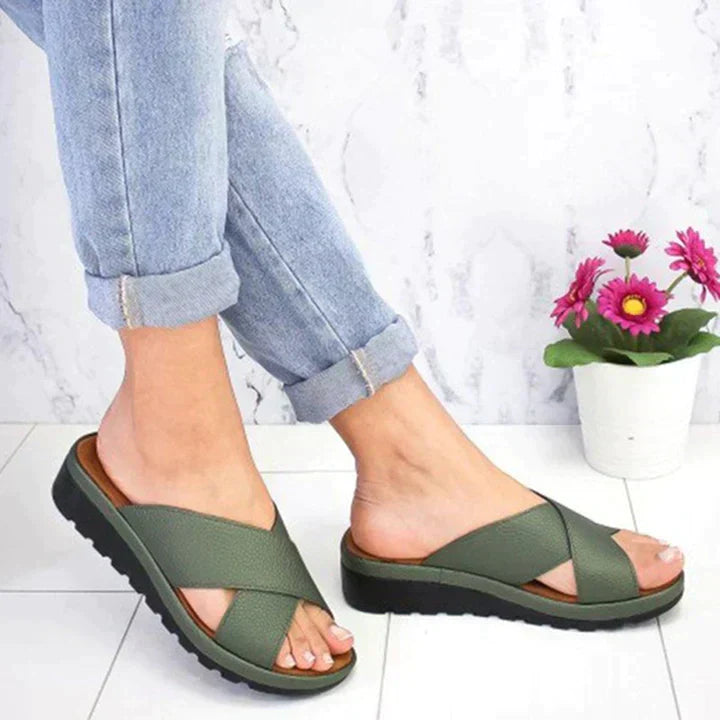 Women's orthopedic adjustable sandals in neutral tones with contoured sole and chic silhouette