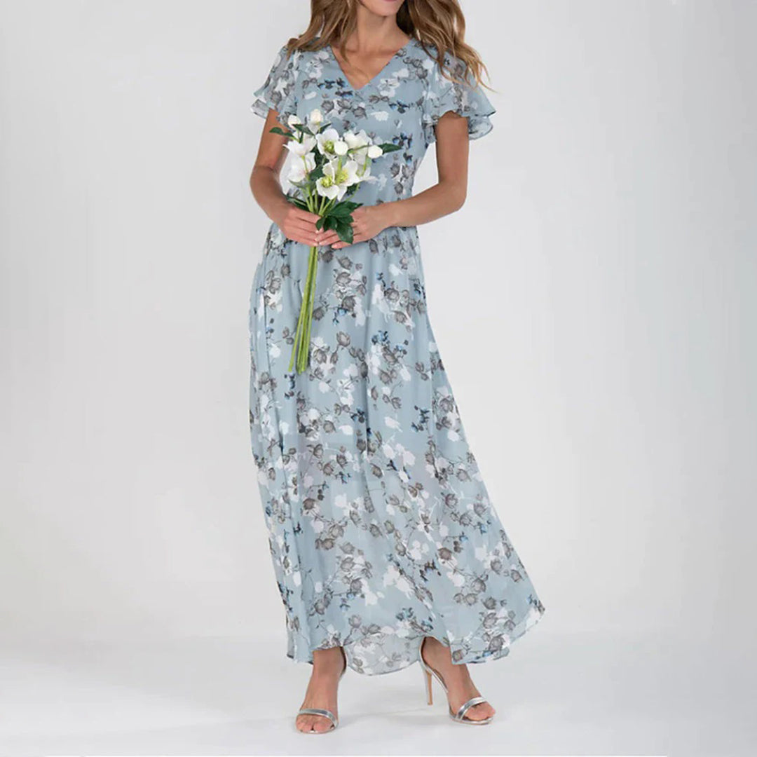 Women's floral maxi dress with V-neck, short ruffle sleeves, elegant airy silhouette for sunny days