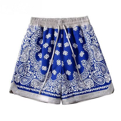 Loose fit paisley print basketball shorts in bandana pattern with elastic drawstring waist and side pockets