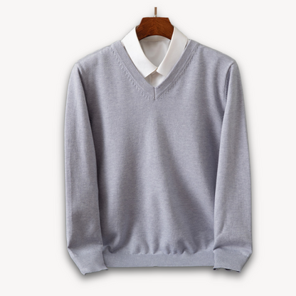 Men's navy blue slim fit V-neck sweater in soft knit with ribbed edges for a polished look