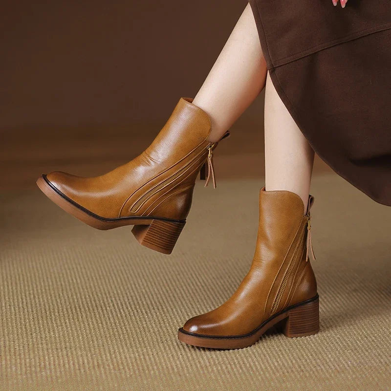 Black leather ankle boots with side-zip tassel pull and stacked block heel, sleek everyday style