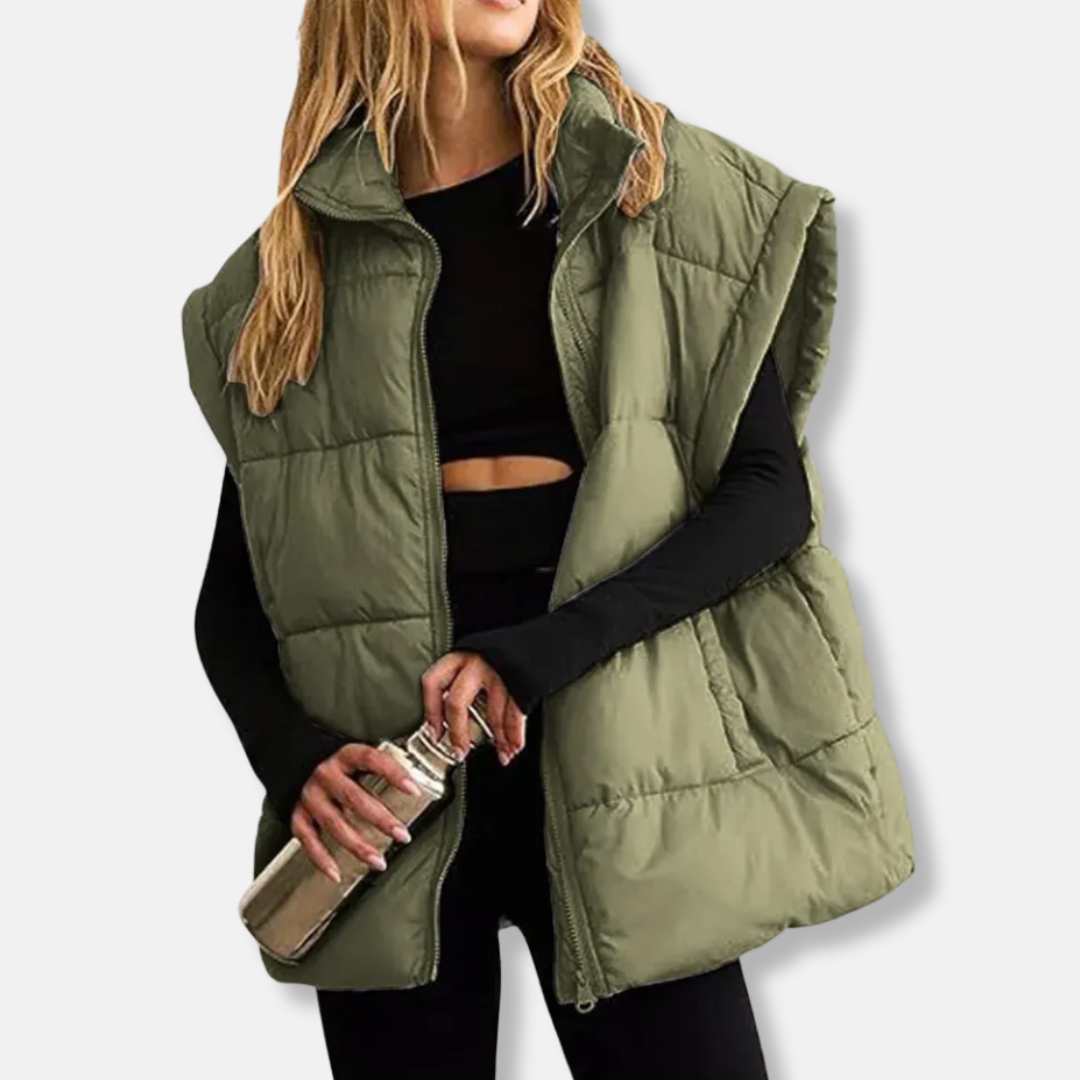 Women's quilted puffer vest hip-length silhouette with stand collar in sleek transitional style