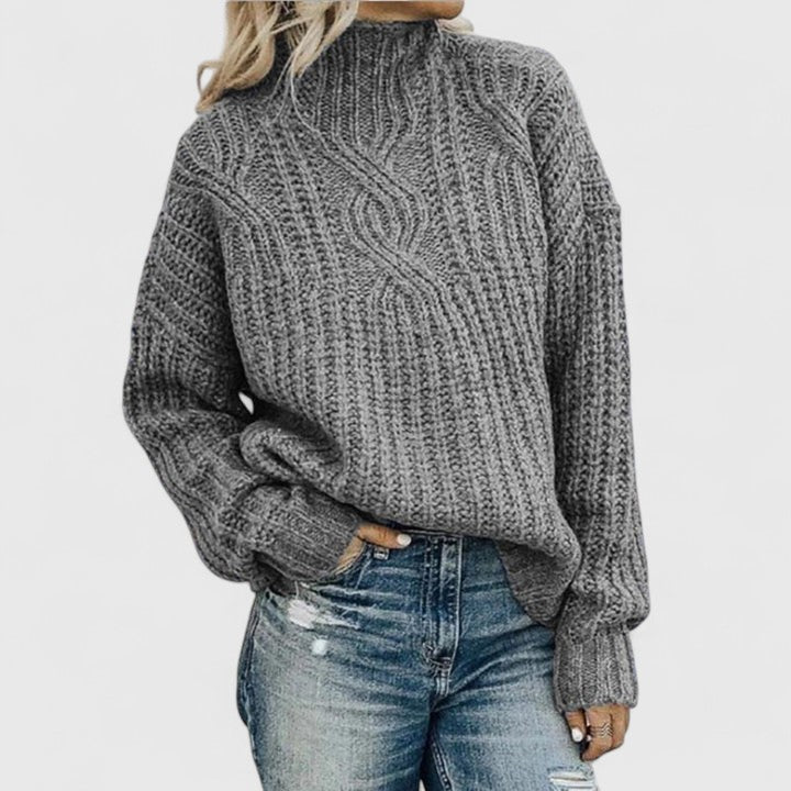 Sophisticated tailored sweater in neutral tones with a flattering slim silhouette and luxurious soft knit
