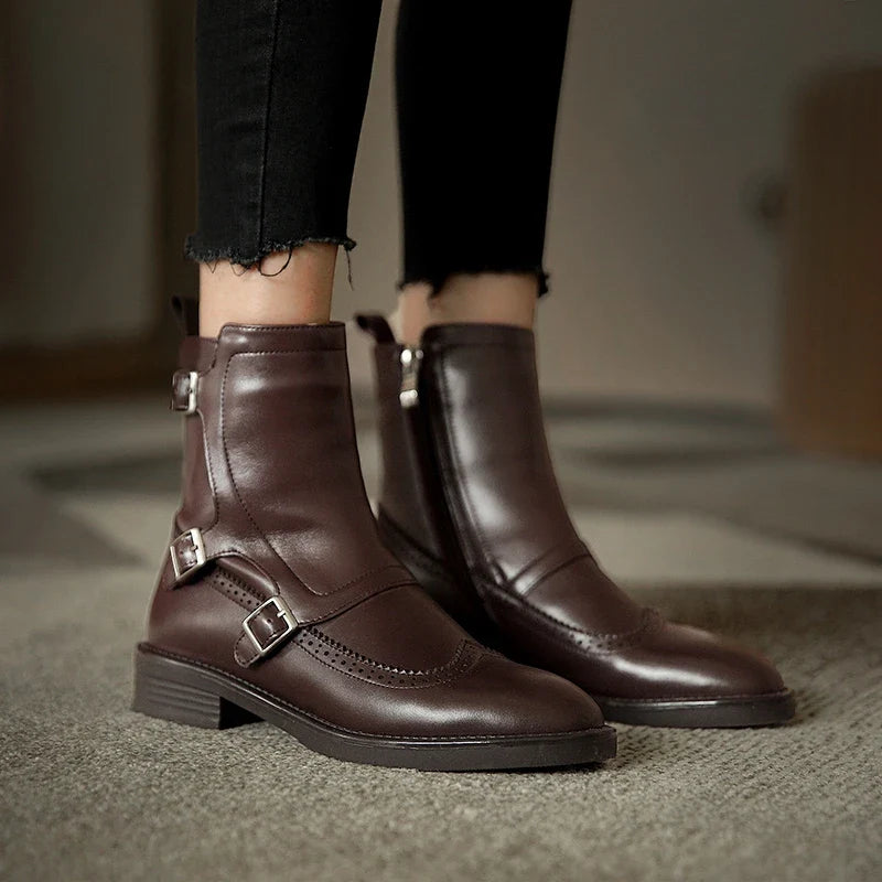 Women's black vegan leather Chelsea boots with elastic side panels and sleek ankle silhouette