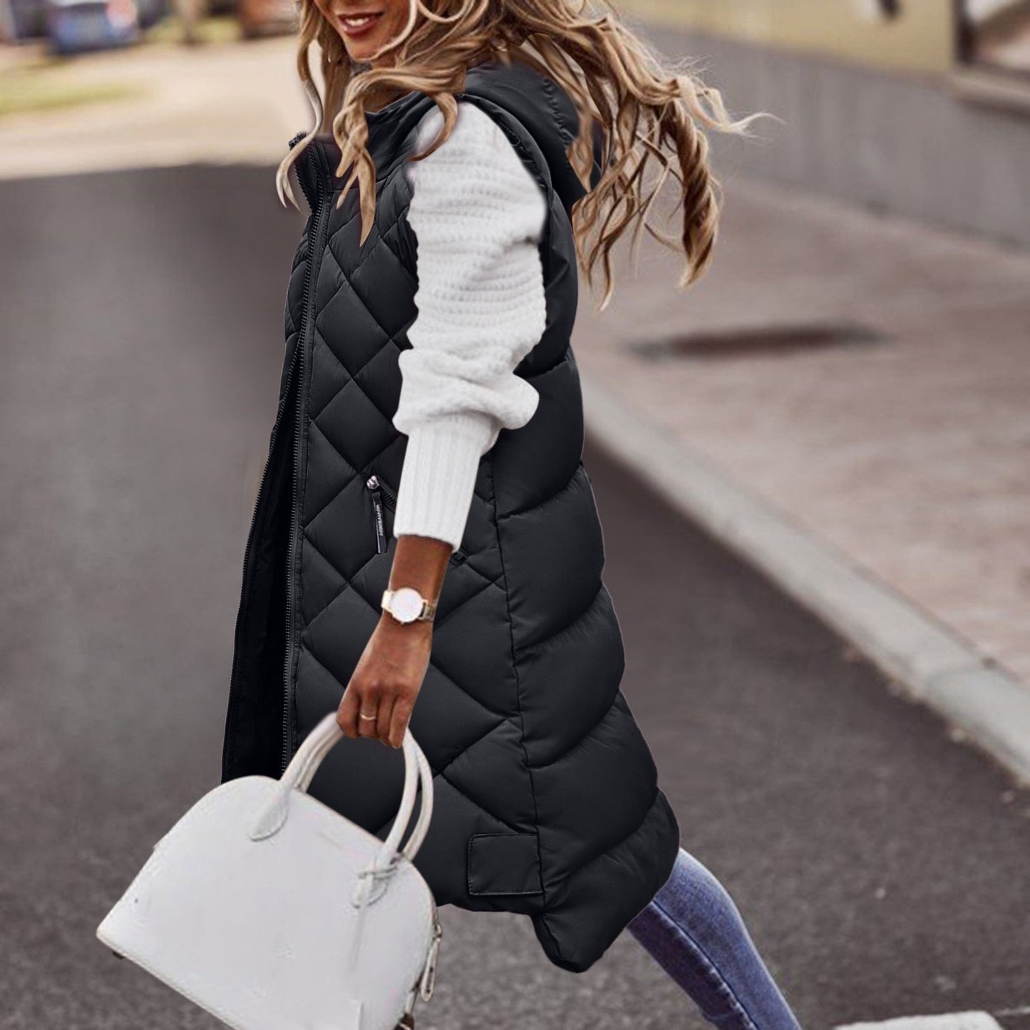 Women's black quilted longline hooded vest relaxed fit with zipper pockets insulated layering essential